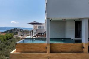 a house with a swimming pool on top of it at Villa Teraco in Makarska