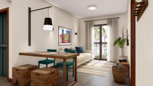 a living room with a table and a couch at Eco Resort Quinta Santa Bárbara in Pirenópolis