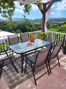 a table and chairs on a patio with a view at Mount Joy Getaway in Parham