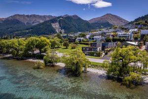 an aerial view of a town next to a body of water at The Ivy Box Apartment in Queenstown