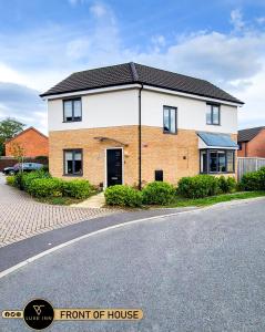 a home with a front of house on a street at LUXE INN, Birmingham Airport & NEC, FREE Parking in Marston Green