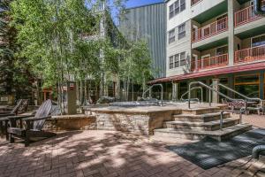 a fountain in the middle of a courtyard in a building at Silver Mill 8154 in Keystone