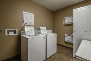 a laundry room with two washer and dryers at Silver Mill 8154 in Keystone