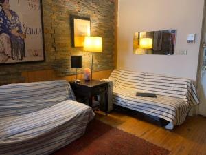 a room with two beds and a desk with a lamp at John 3 16 Christian BnB in New York