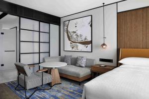 Voodi või voodid majutusasutuse Sheraton Zhaoqing Dinghu toas
