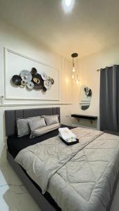 a bedroom with a large bed in a room at The Glory Villas in Batu +29 photos