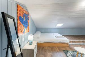 Postel nebo postele na pokoji v ubytování GuestReady - Rooftop Retreat near Amarante Garden