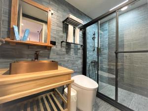 a bathroom with a sink and a shower at 95 Pavilion in Jiufen +87 photos