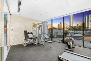 a gym with a view of the city at Avalon Apartments - Wow Stay in Gold Coast
