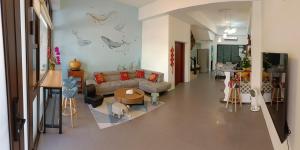 a living room with a couch and a table at 埔里包棟民宿木子小屋 in Puli