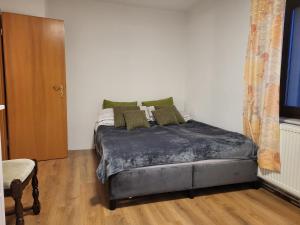 Ένα ή περισσότερα κρεβάτια σε δωμάτιο στο Haus Svetlana Ferienwohnung