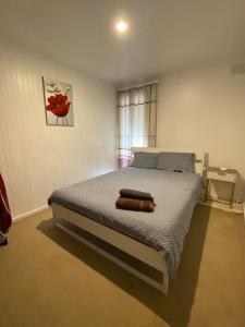 Postel nebo postele na pokoji v ubytování ADA Homestay