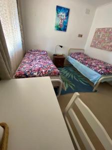 Postel nebo postele na pokoji v ubytování ADA Homestay