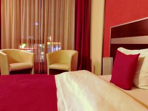 Postel nebo postele na pokoji v ubytování Hotel Angellis
