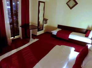 Postel nebo postele na pokoji v ubytování Hotel Angellis