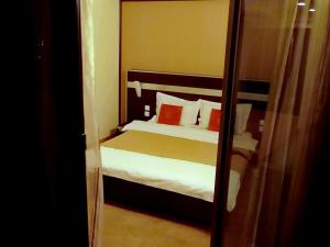 Postel nebo postele na pokoji v ubytování Hotel Angellis