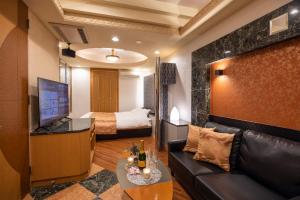 TV a/nebo společenská místnost v ubytování VALENTINE RESORT(大人専用）
