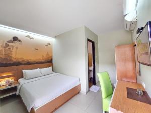 Postel nebo postele na pokoji v ubytování Shinta Guesthouse