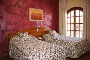 Postel nebo postele na pokoji v ubytování Hotel La Curva