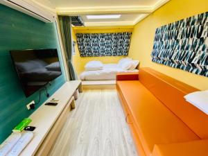 Postel nebo postele na pokoji v ubytování 見晴花園山莊Sunshine Villa