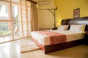 Ένα ή περισσότερα κρεβάτια σε δωμάτιο στο Hotel Safari Gate