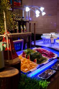 a buffet of vegetables and meats on a table at Holiday Inn Qingdao Expo, an IHG Hotel in Qingdao