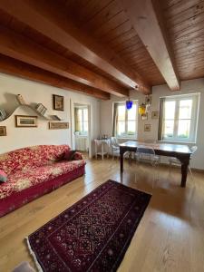 a bedroom with a bed and a table in a room at Residenza l'Antico Borgo in Trieste