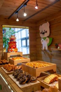 a bakery with many different types of pastries in boxes at Holiday Inn Qingdao Expo, an IHG Hotel in Qingdao