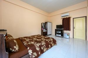 Voodi või voodid majutusasutuse Beung Sampathuan Nakornchaisri Resort toas
