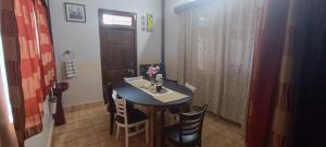 a small table and chairs in a small room at Tito's Homestay in Kalimpong