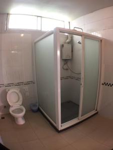 a bathroom with a shower with a toilet in it at Baan Pai Riverside Resort in Pai