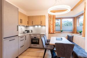 Kuchyň nebo kuchyňský kout v ubytování Dorfresort Kitzbühel by ALPS RESORTS