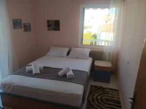 Postel nebo postele na pokoji v ubytování Anestis Apartment