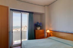 Кровать или кровати в номере Hotel Palace