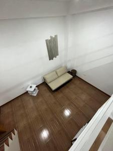 a room with a couch in the corner of a room at ARJ Property Rental in Paringao La Union in Bauang