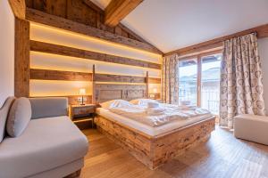 Postel nebo postele na pokoji v ubytování Dorfresort Kitzbühel by ALPS RESORTS