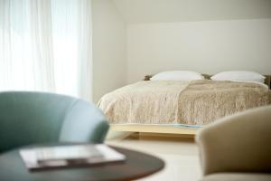 Postel nebo postele na pokoji v ubytování Boutique Hotel Imperialart