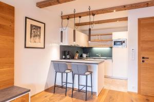 Kuchyň nebo kuchyňský kout v ubytování Dorfresort Kitzbühel by ALPS RESORTS