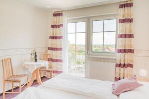 Fotografie z fotogalerie ubytování Haus Kranixfeld-Fischl v destinaci Mörbisch am See