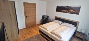 Posteľ alebo postele v izbe v ubytovaní Ferienwohnung am Lindenweg
