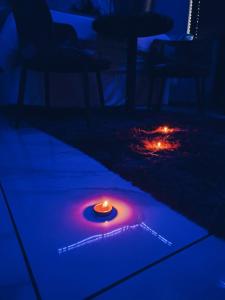 a candle on a table in a dark room at National Lodge in Benoni