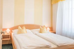 Ένα ή περισσότερα κρεβάτια σε δωμάτιο στο Haus Kranixfeld-Fischl
