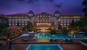 a hotel with a pool in front of a building at Hyatt Regency Kathmandu in Kathmandu