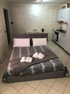 a bedroom with a bed with two towels on it at APPARTAMENTO Tamburro in Campobasso