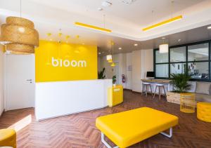 a store with a yellow and white counter in a room at Bloom Hotel - Bengaluru Airport in Devanhalli