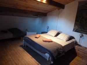 a bedroom with a bed with two pillows on it at Casa di Ceppo in Patrimonio