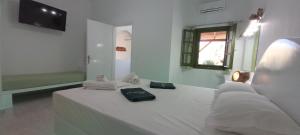 A bed or beds in a room at Leros Eleonas ApartmentS