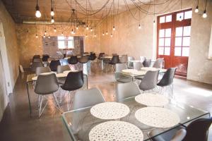a large room with tables and chairs in it at Zatoka Kal in Węgorzewo