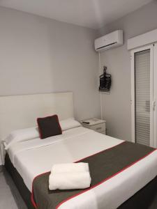 Postel nebo postele na pokoji v ubytování Hostal Jireh