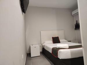 Postel nebo postele na pokoji v ubytování Hostal Jireh